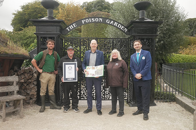 alnwick-poison-garden-gwr-certificate-in-front-of-poison-garden-gates