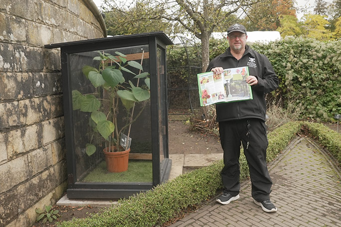 alnwick-poison-garden-gympie-gympie-with-gardener-holding-gwr-2027-book