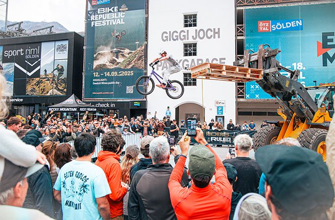 Mario dropping off the platform off his bike