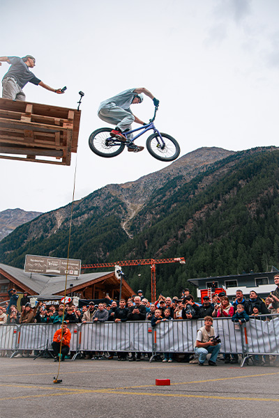 Mario dropping off the platform on his bike