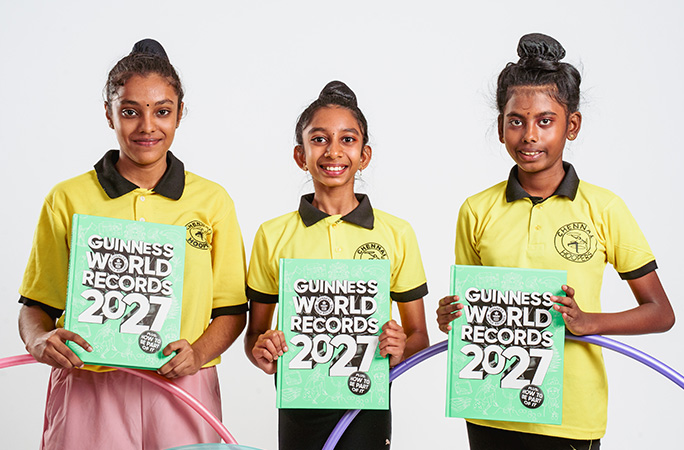Chennai Hoopers holding their copies of GWR 2027