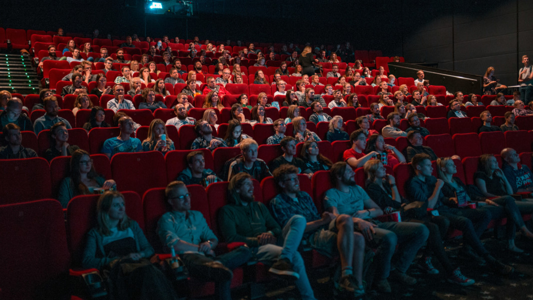 Photo of a packed crowd at a movie theatre