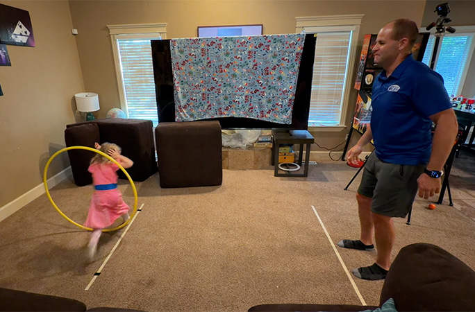 Felicity running through the hoop
