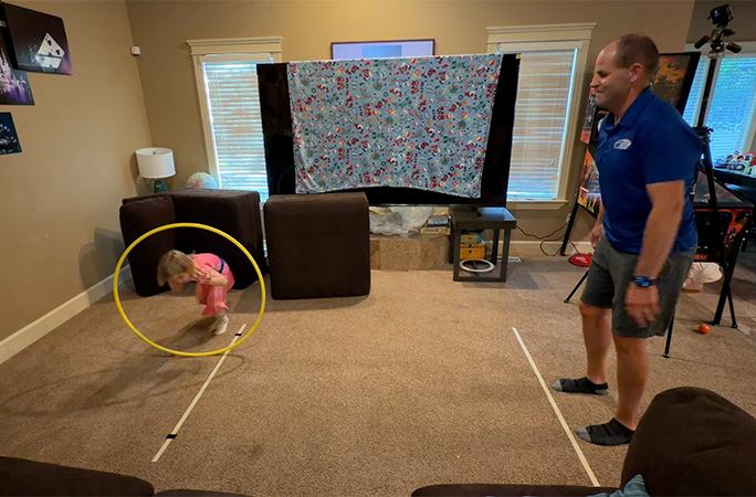 Felicity running through the hoop