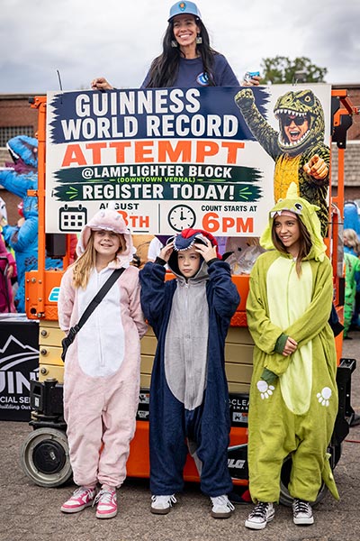 Participants in the largest gathering of people dressed as dinosaurs