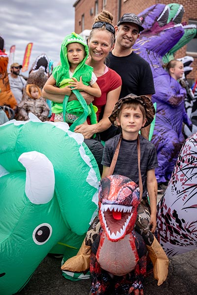 Participants in the largest gathering of people dressed as dinosaurs