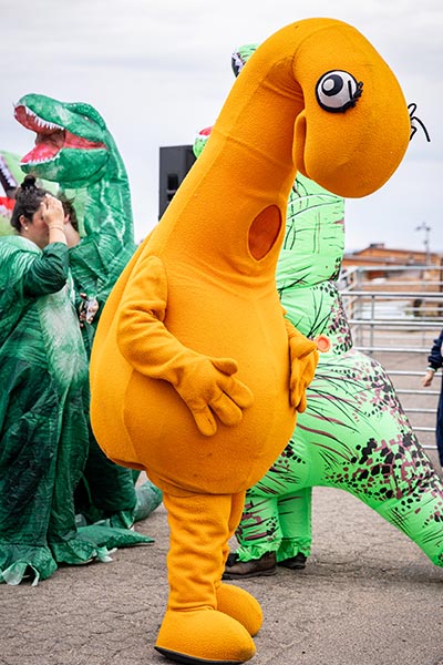 Participants in the largest gathering of people dressed as dinosaurs