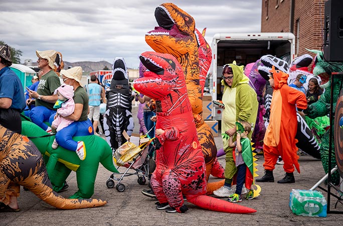 Participants in the largest gathering of people dressed as dinosaurs