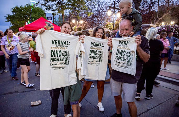 Participants in the largest gathering of people dressed as dinosaurs