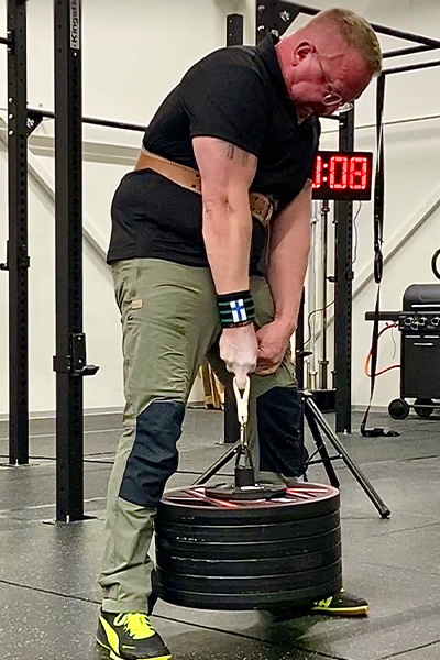 Juha doing a deadlift with one finger