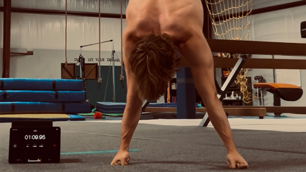 Madden doing a knuckle handstand