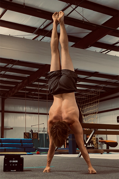 Madden doing a knuckle handstand
