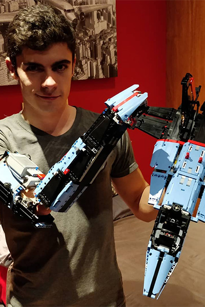David with one of the arms he built from LEGO