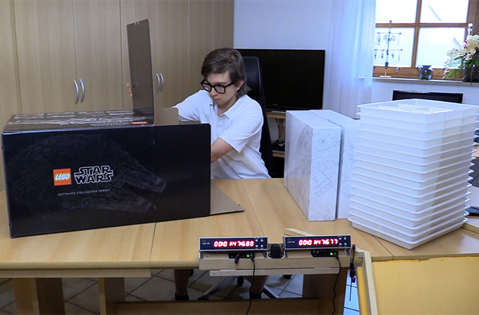 Lukas unboxing the lego set