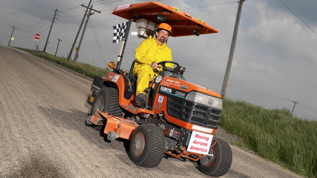 Gary Hatter driving his lawnmower on the road
