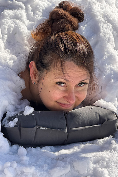 Maria's head sticking out of snow