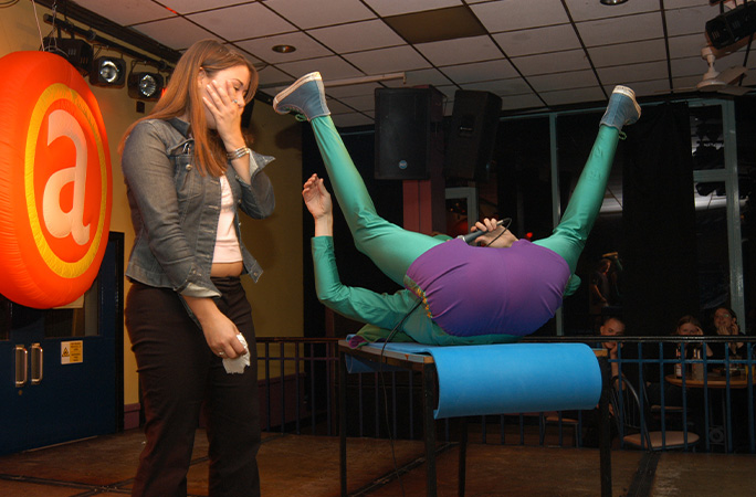Mr Methane on stage with a shocked woman