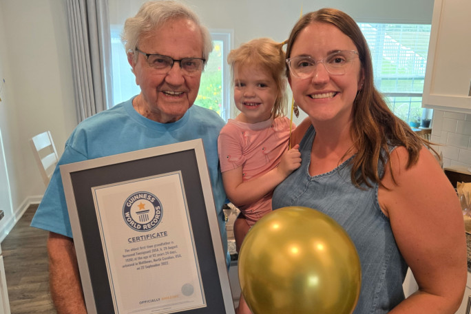 Normand holding his GWR certificate, and Kerry holding Madison