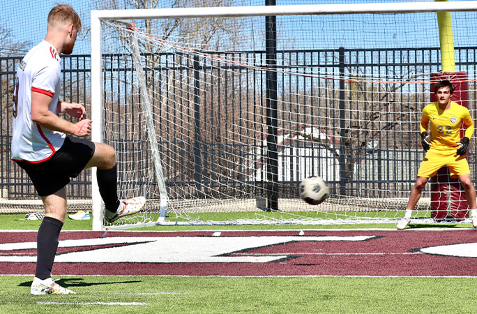 Sam shooting a penalty