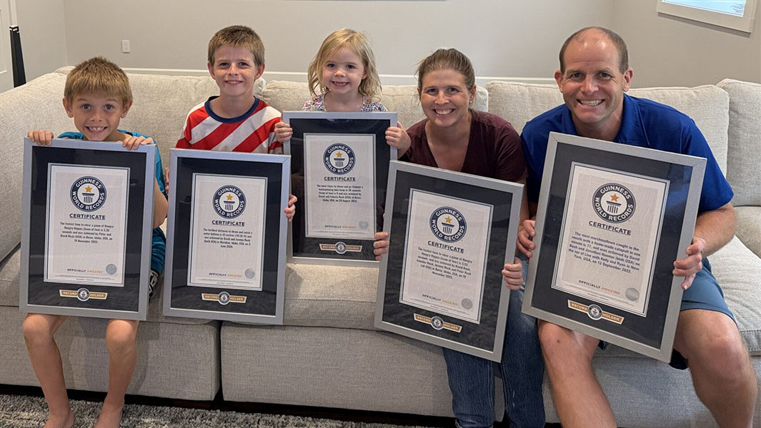 David Rush, his wife and kids all pose with Guinness World Records certificates