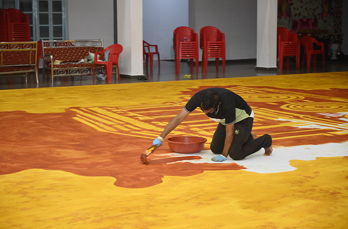 Amar working on the painting