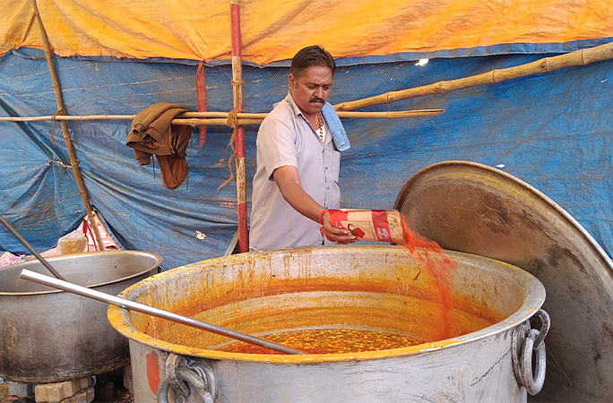 spices being prepared in a giant pot