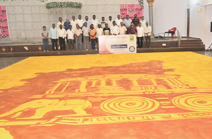 group of people standing next to the painting