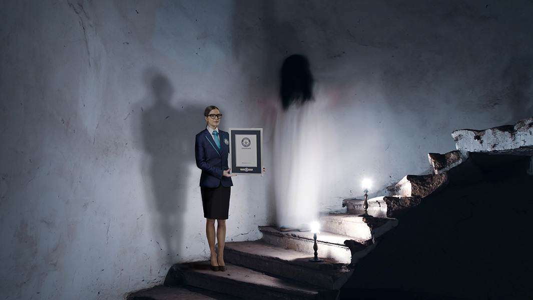 Illustration of a GWR adjudicator presenting a certificate to a ghost