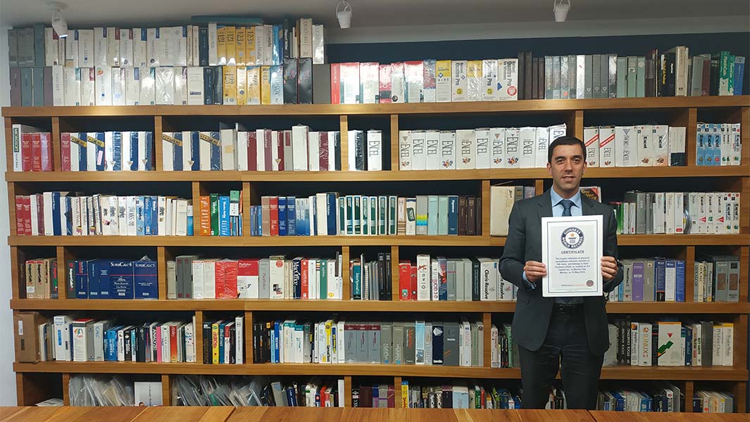 Ariel Fischman with his collection of spreadsheet software