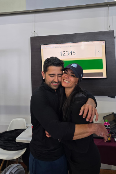 Enrique hugging his wife