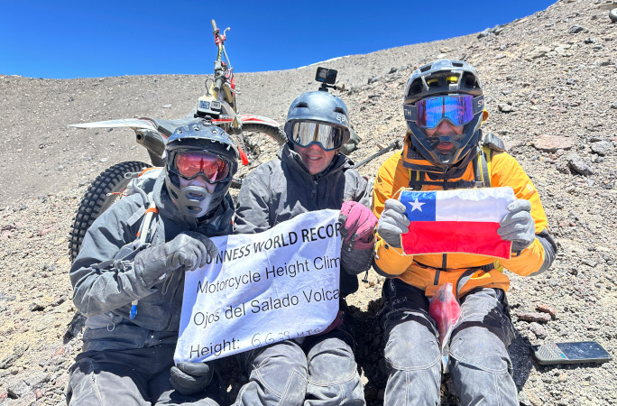 The Rencorets at the summit with the Chilean flag