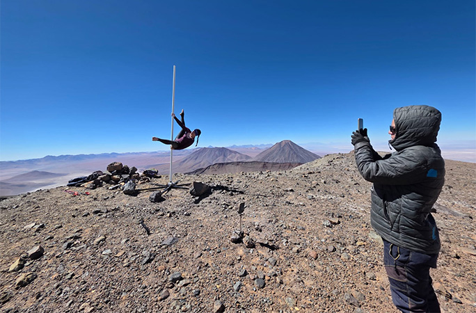 Fiona having her picture taken while pole dancing
