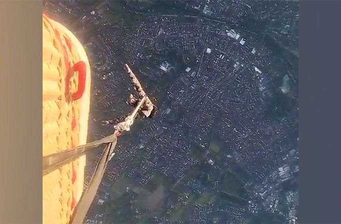 Marlene danling beneath the balloon