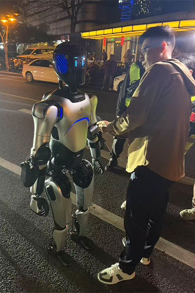 robot standing next to a person