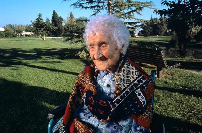 Jeanne Calment sitting in a garden