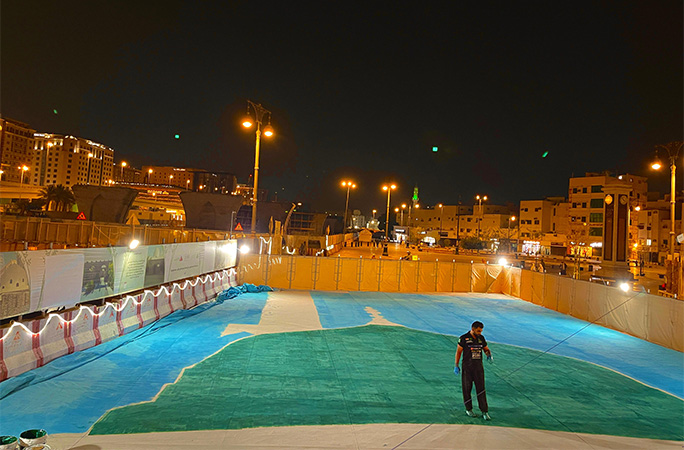 Zakir standing on the painting