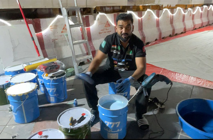 Zakir with buckets of paint