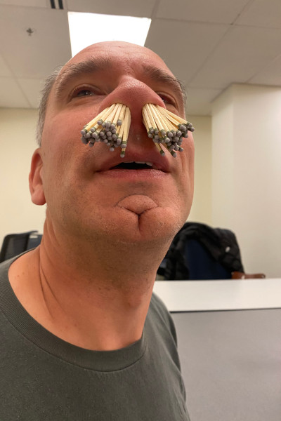 Scott with the matches in his nose, lower angle