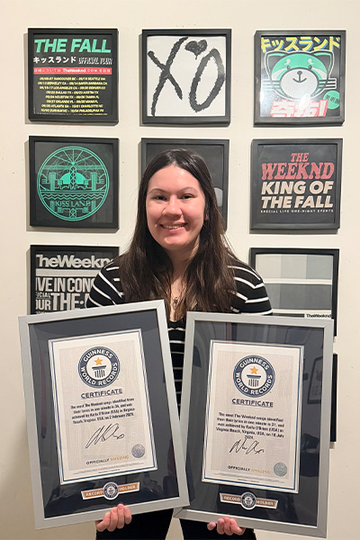 Karla with her signed certificates