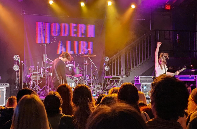 Band with a female singer rocking out