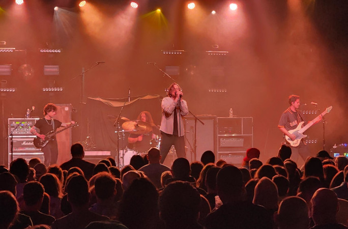 A musician singing into the microphone