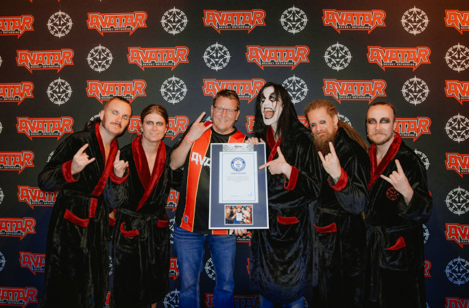 Tim and his favorite band Avatar posing with his GWR certificate