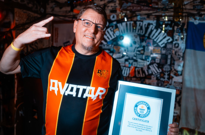 Tim pointing at his GWR certificate