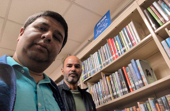 the two men in a library