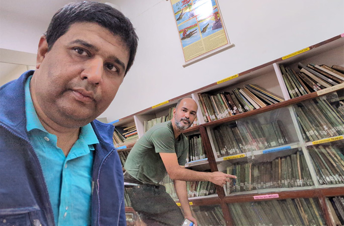 the two men in a library