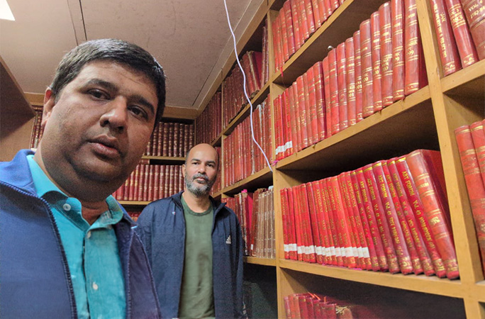 the two men in a library