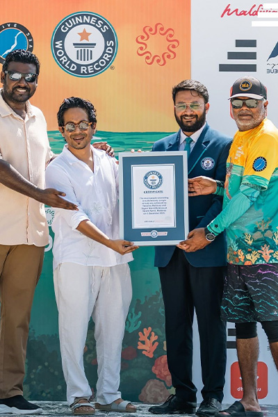 people posing with certificate