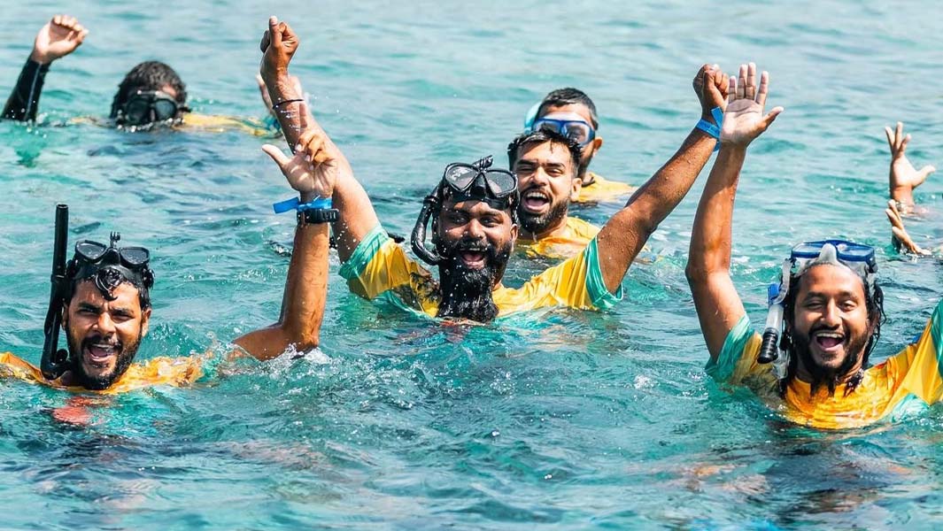 split header of people snorkelling and celebrating