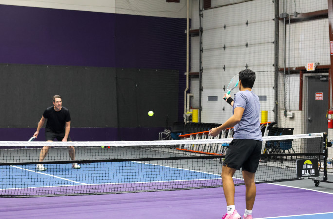 Players from the pickleball marathon exchanging volleys