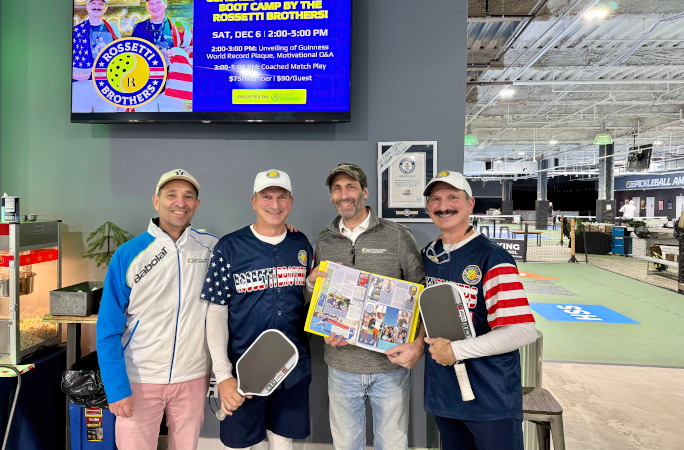 The Rossetti twins posing with their certificate